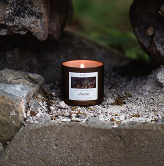 Candle with a label inside a stone wall